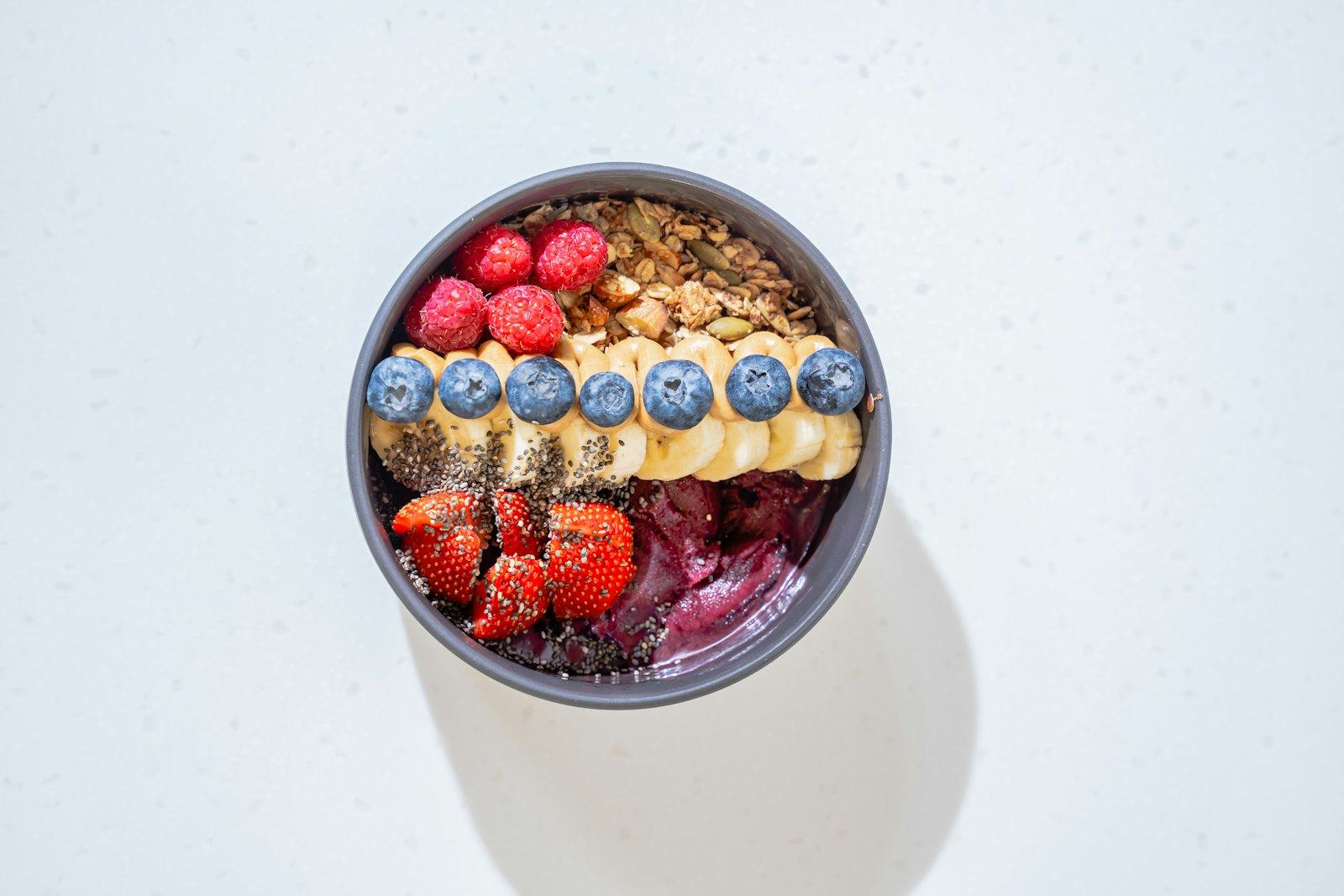 Acai bowl topped with berries and banana