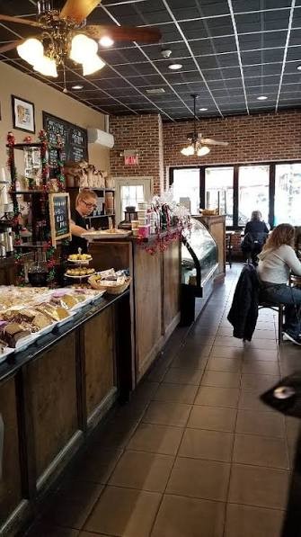 Inside Babylon Bean: brick walls, ceiling fans and the pastry counter