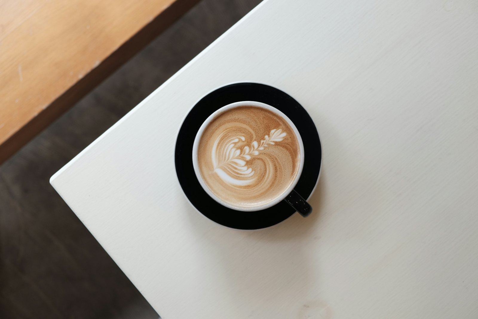 Latte art in a black cup
