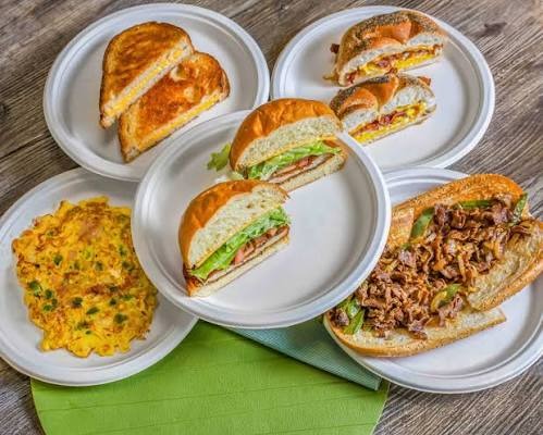 A spread of breakfast sandwiches and an omelet from Babylon Bean North